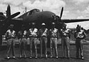 Czech night ace RAF Flight Lt. Karel Kuttelwascher poses with AAF night fighter training officers