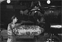Loading a bomb aboard a P-61 for a night intruder mission