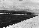 The 419th Squadron's 'Old Salty Dog' on a takeoff run down the pierced steel planing runway of Middelburg Island, Dutch New Guinea, January 1945