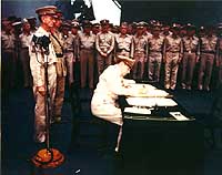 Photo # USA C-4627:  General of the Army Douglas MacArthur signs the Japanese Instrument of Surrender 2 September 1945.