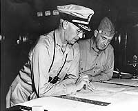 Photo # 80-CF-112-4-63:  RAdm. R.K. Turner & MGen. A.A. Vandegrift on board USS McCawley, circa July-August 1942
