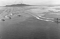 Photo # 80-G-220760:  Destroyers in Iron Bottom Sound, with Savo Island in the distance, February 1944