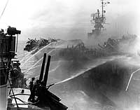 Photo # 80-G-270357:  USS Birmingham fighting fires on USS Princeton, 24 October 1944