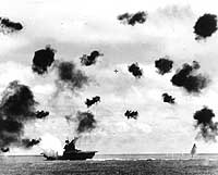 Photo # 80-G-414423:  USS Yorktown is hit by a Japanese aerial torpedo, 4 June 1942