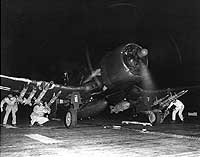 Photo # 80-G-419929: Marine Corps F4U-4B fighter bomber ready to take off from USS Sicily, off Korea, 1950