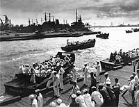 Photo # 80-G-474987: Liberty parties shove off from the Pearl Harbor Navy Yard, July 1945. Photographed by Lt. Paul Dorsey, USN