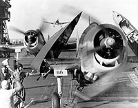Photo # 80-G-59314:  F6F fighters landing on USS Enterprise after strikes on Truk, 17-18 February 1944