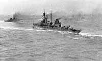 Photo # NH 41763:  HMS Agincourt operating at sea in 1918 with all fourteen of her twelve-inch guns trained out to port.