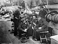 Photo # NH 47029-A:  'Spinning a Yarn' -- Veteran sailors telling tall tales on board USS Enterprise, circa 1887