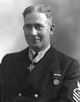 Photo # NH 57893:  Chief Metalsmith James H. McDonald wearing the Medal of Honor, January 1940