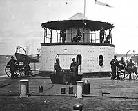 Photo # NH 61925:  Officers on the deck and turret of USS Catskill, 1865