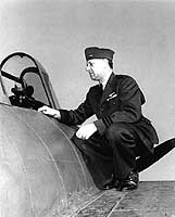 Photo # NH 93186: Commander Clarence Wade McClusky poses on a F4F fighter plane, 6 February 1943