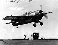 Photo # 80-G-94875:  FM-2 fighter gets a wave-off while attempting to land on USS Makin Island, circa 1944-1945