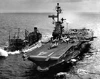 Photo # NH 97487:  USS Ticonderoga refueling from USS Ashtabula off the coast of Vietnam, circa 1966