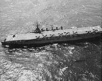Photo # NH 97612: USS Saipan at sea, with FH-1 jet fighters on deck