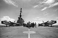 Photo # NH 97634: Preparing to catapult a pair of F-8 fighters on board USS Midway, circa 1963