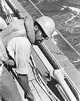Photo # NH 98213:  USS Springfield crewman handling a line, Sept. 1972.  Photographed by PH2c Harry E. Deffenbaugh, Jr.