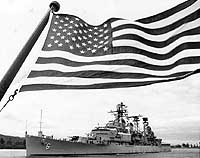 Photo # NH 98547:  USS Providence framed by the U.S. Ensign, circa the early 1970s