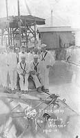 Photo # NH 98656:  USS Moccasin crewmen pose on board their submarine, circa 1910-1911