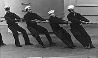 Photo # NH 98965:  Crewmen handling lines on board USS Little Rock, April 1975