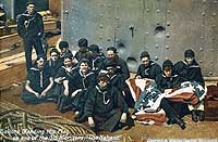 Photo # NH 100797-KN: Crewmen mending the flag on board the monitor Nahant, 1898.
