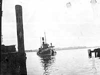 Photo # NH 103629:  Tug Edgar F. Coney alongside a smaller tug, prior to her World War I era U.S. Navy service