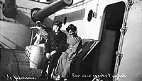 Photo # NH 106109:  U.S. Navy Chief Machinist's Mate poses with a Japanese lady on the deck of a Great White Fleet battleship, October 1908