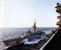 Photo # NH 107477-KN:  USS Vreeland refueling from USS Dwight D. Eisenhower in the Mediterranean, circa February-August 1988. Photographed by PH2 Tracy Lee Didas