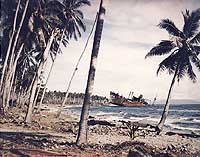 Photo # 80-G-K-1467-A:  Japanese cargo ship Kinugawa Maru beached and sunk on the Guadalcanal shore