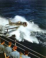 Photo # 80-G-K-3725: SC-1 floatplane comes alongside USS Alaska for recovery, March 1945