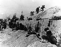 Photo # SC 190062:  Troops move out over the seawall on Utah Beach, 6 June 1944