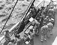 Photo # SC 255942:  Army troops draw ammunition on board USS Joseph T. Dickman before the North Africa invasion, November 1942