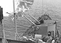 Photo # USN 1119540:  USS Newman K. Perry firing her five-inch guns on enemy positions in Vietnam, 16 December 1966.  Photographed by PH1 R. Wasmer