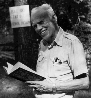 Walker Percy Smiling Holding a Book