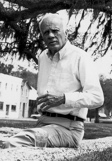 Walker Percy Sitting on a Seawall with Bourbon